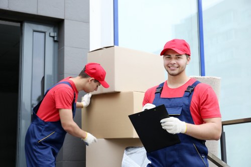 Loading furniture and boxes into a moving van in Kidbrooke