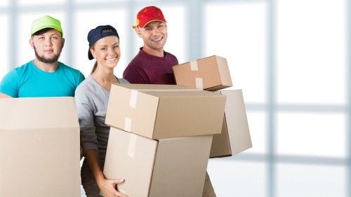 Professional movers handling boxes during a Kidbrooke relocation