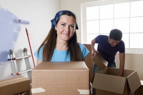 Local moving team handling boxes and furniture in Kidbrooke