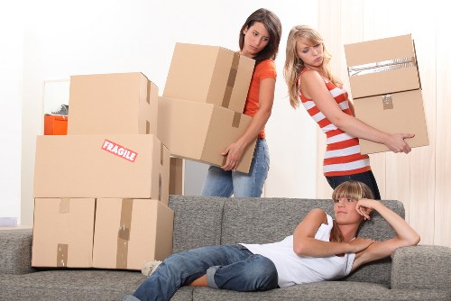 Careful wrapping of fragile household items during a local packing service