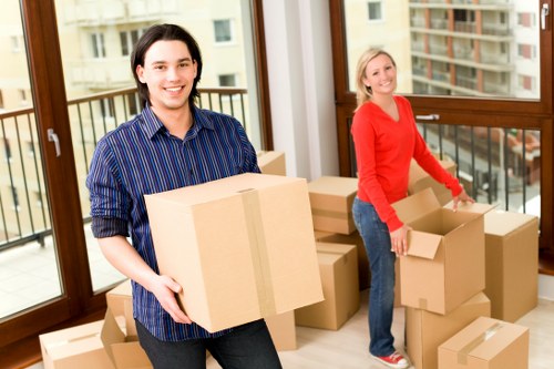 Packed boxes and furniture ready for loading into a removal van in Kidbrooke